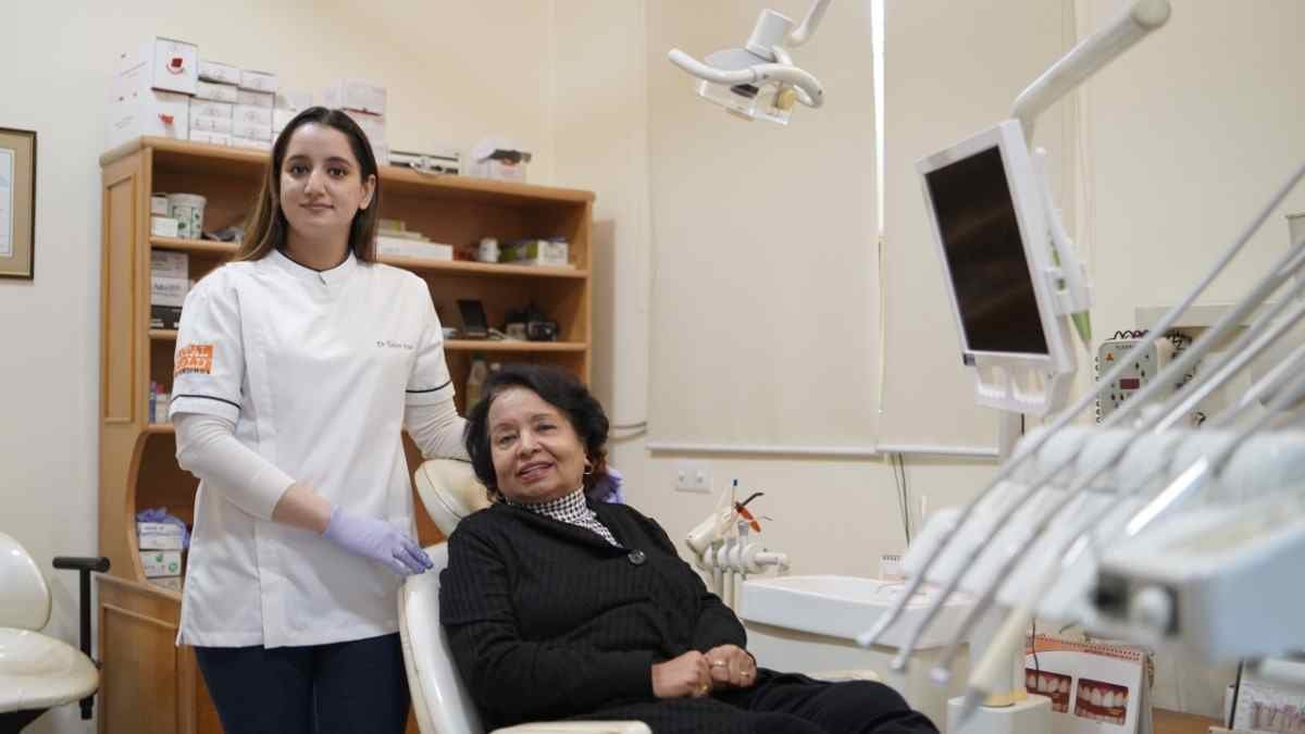 Dental World dentist with a patient seated in the dental chair during a consultation