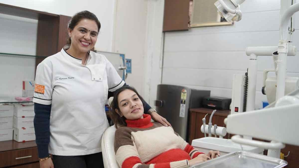 Dr. Harveen Nakra with a young patient in the dental chair at Dental World clinic