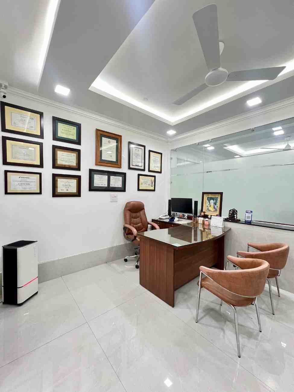 Modern dental treatment room with dental chair, overhead light and clinical equipment at Dental World